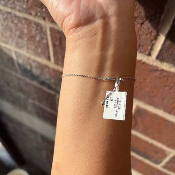 0.04 CT. T.W. Diamond Interlocking Hearts Bracelet in Sterling Silver - 6.75" - Picture 6 of 10